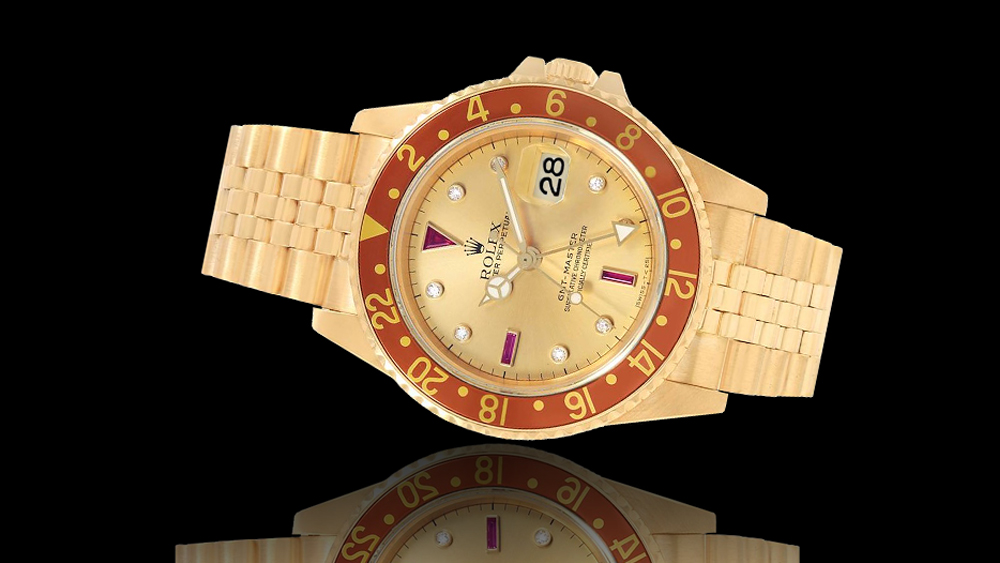 Rolex GMT-Master in oro 40 mm referenza 16758 quadrante champaghe diamanti rubini usato nuovo modelli vendita